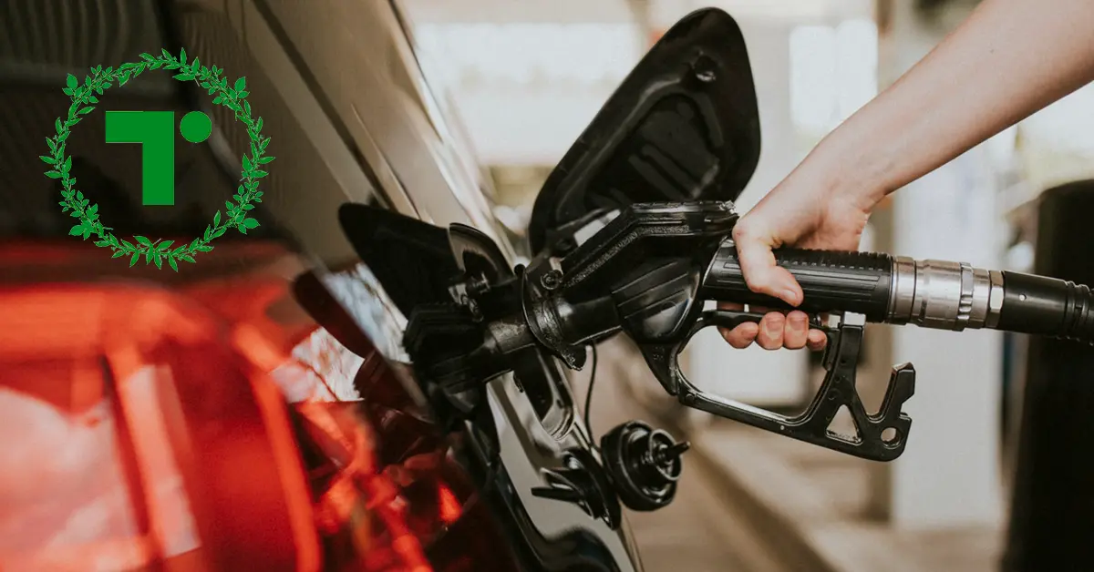 Hand refuelling a car at a petrol pump