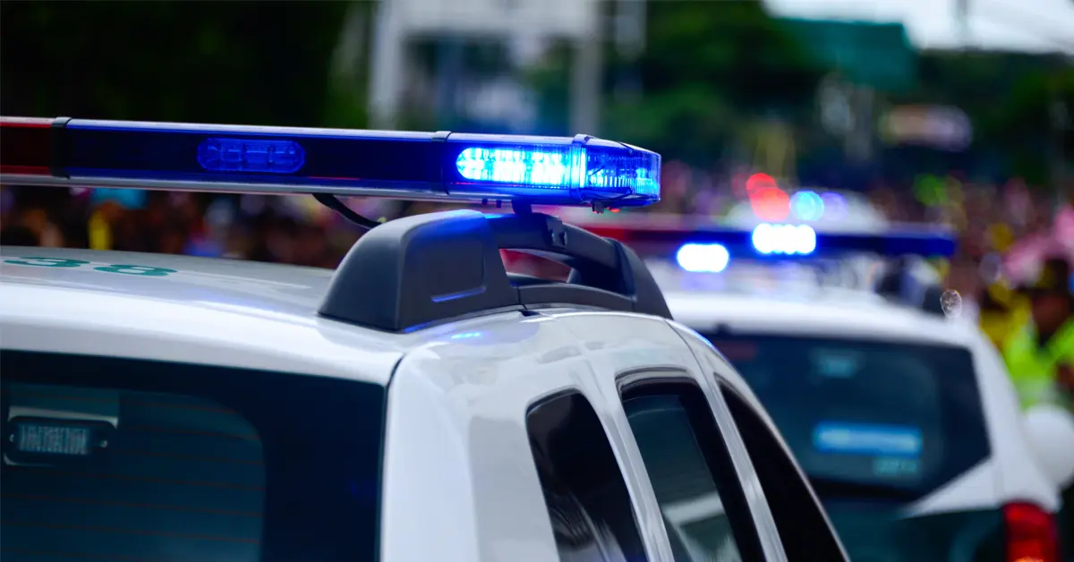 Police car with flashing blue lights