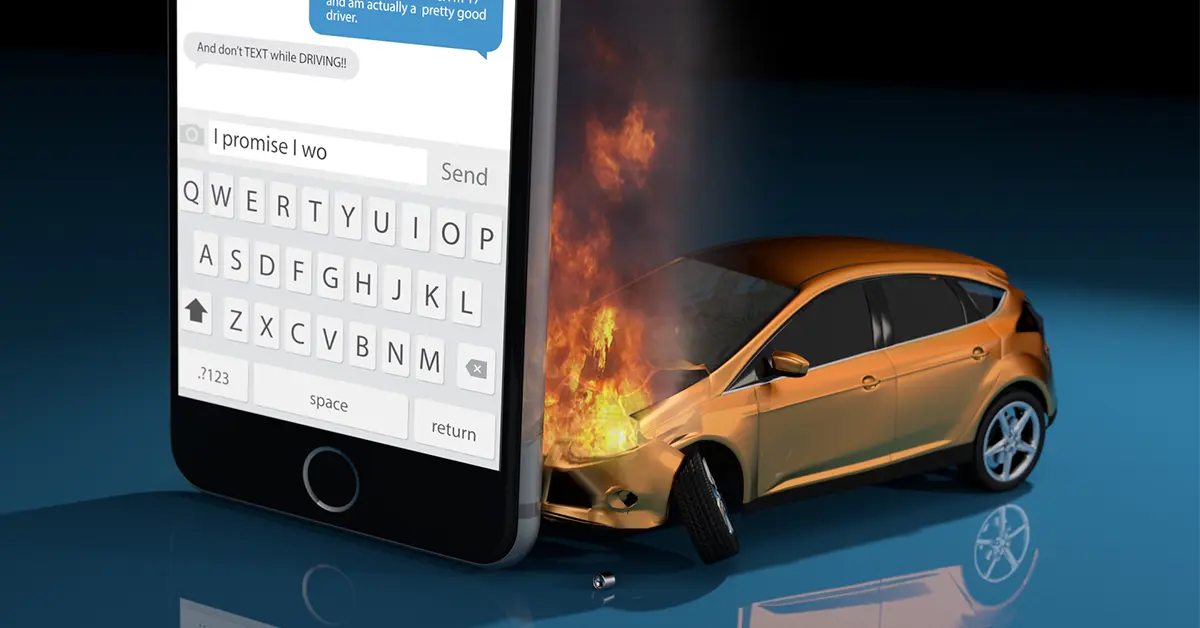 Phone showing a text conversation beside a crashed car on fire